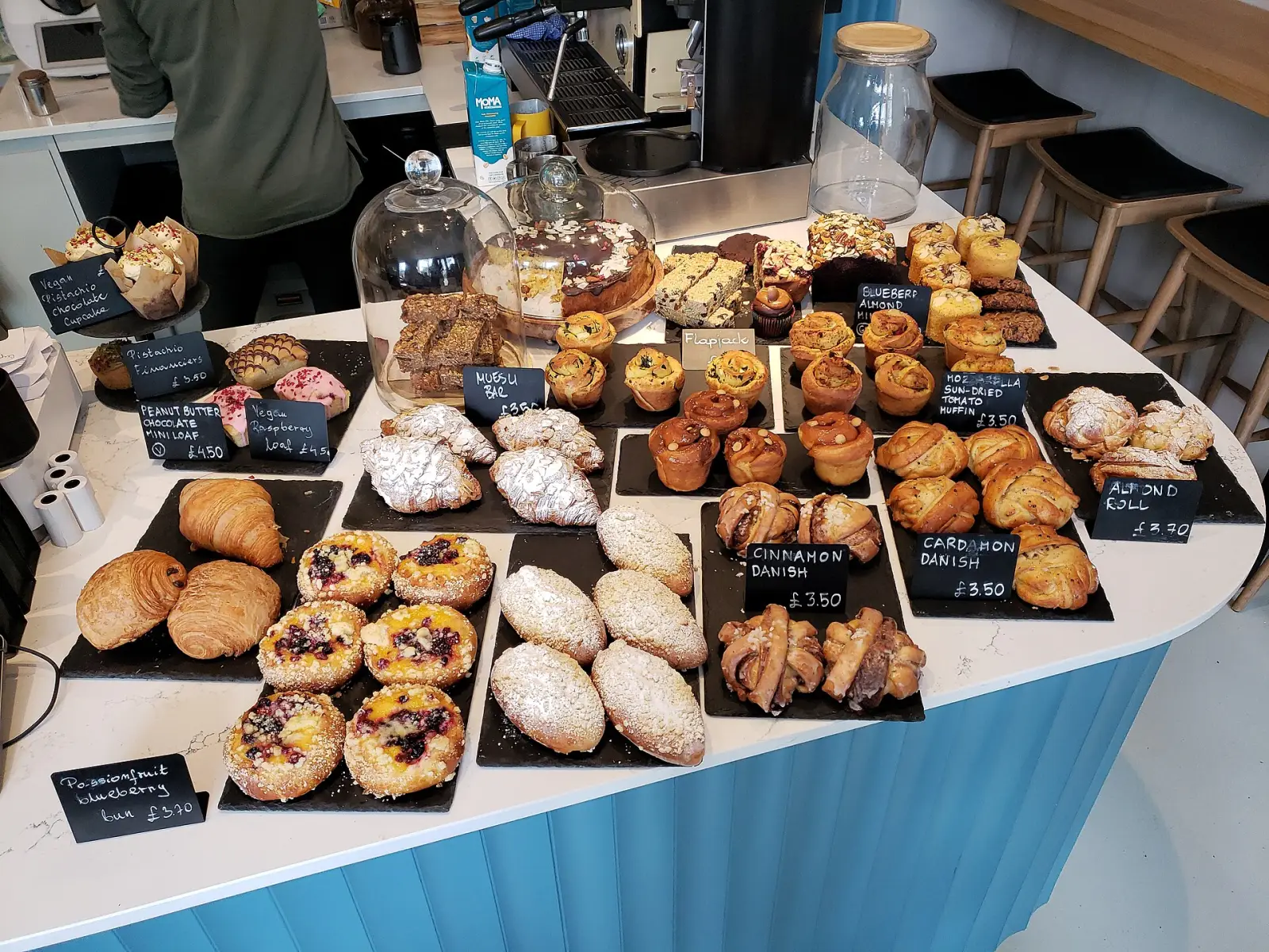 Croissants, Danish pastries and muffins on a bakery counter. The photo was not taken in Wesley Chapel.