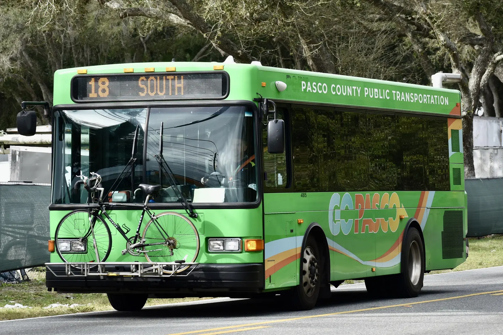 A GoPasco bus, run by Pasco County Public Transportation, with a bicycle on its front rack