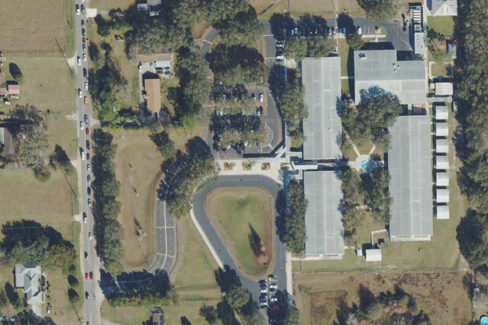 Chester W. Taylor Jr. Elementary School's classroom buildings and car loop off Morris Bridge Road, seen from the air.