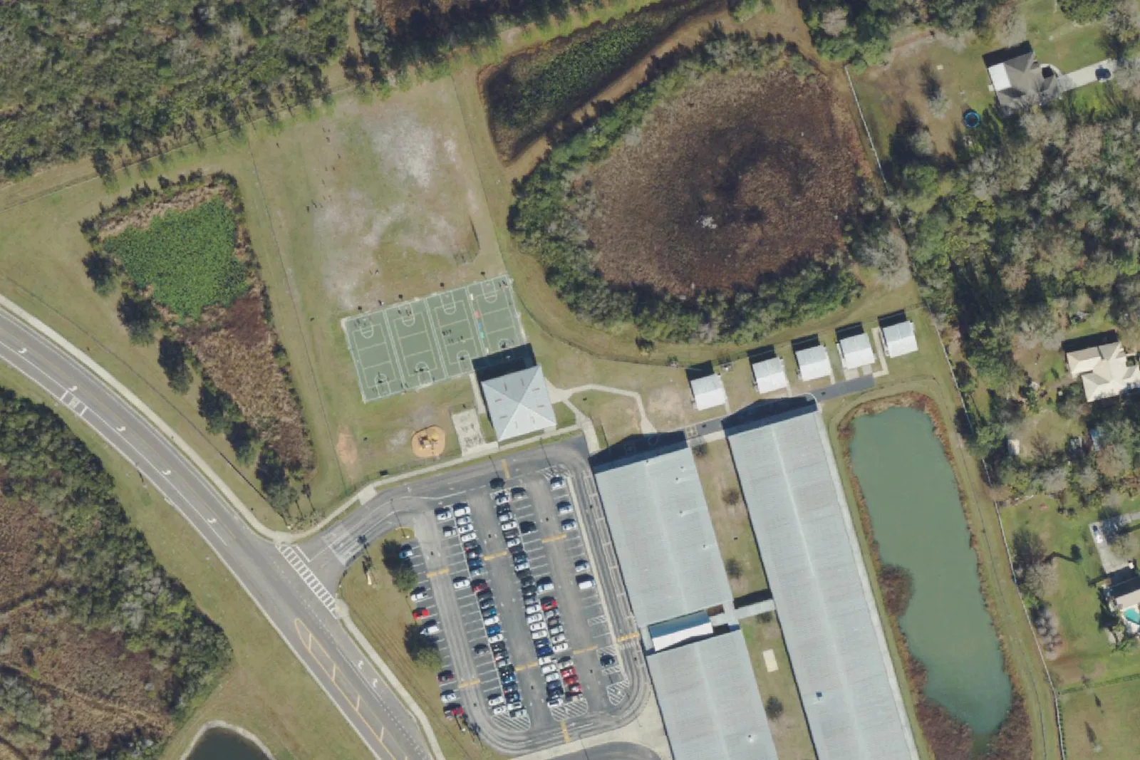 Double Branch Elementary School's classroom buildings and parking lot off Chancey Road in Wesley Chapel, seen from the air.