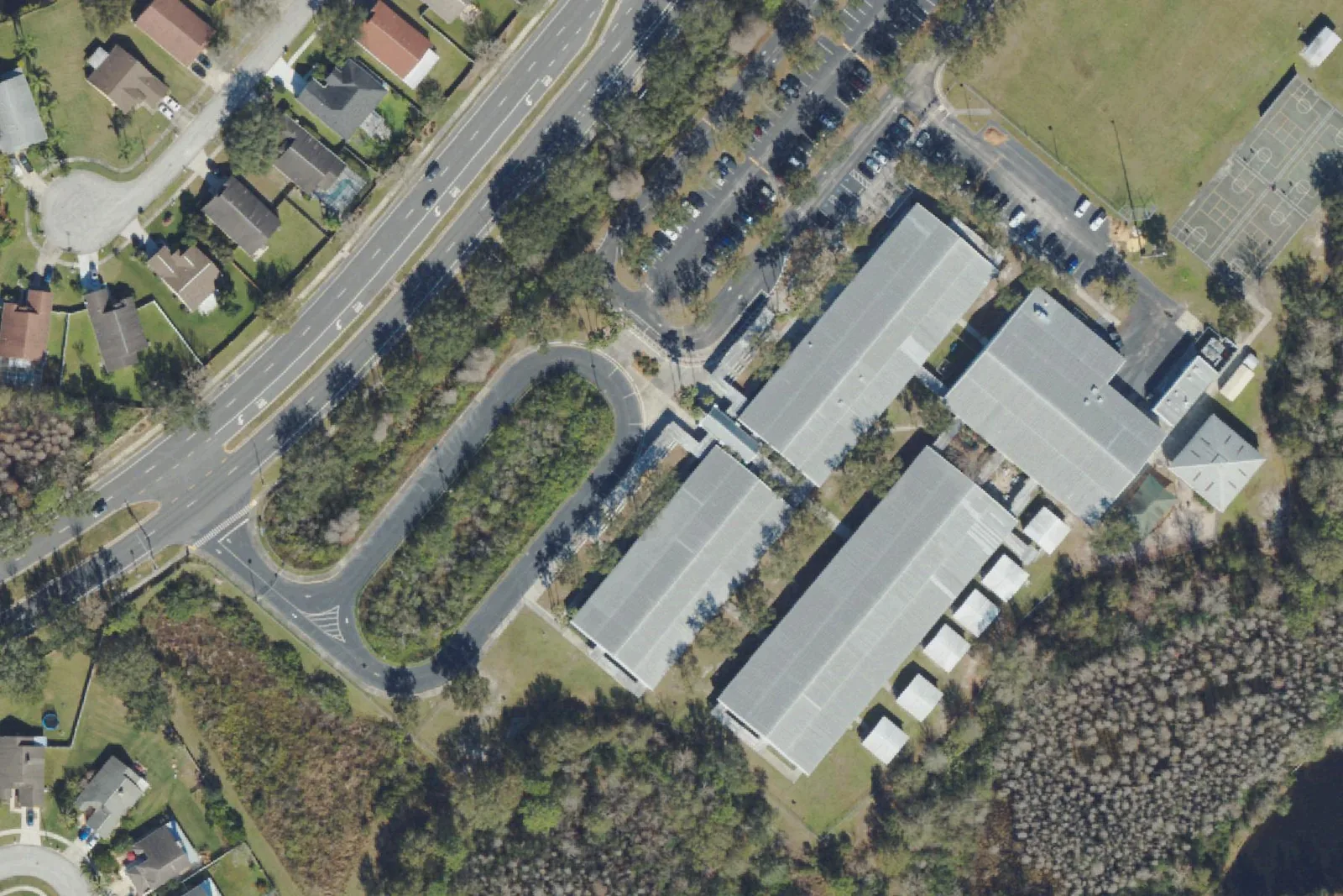 Sand Pine Elementary School's classroom buildings and parking lot on County Line Road in Wesley Chapel, seen from the air.