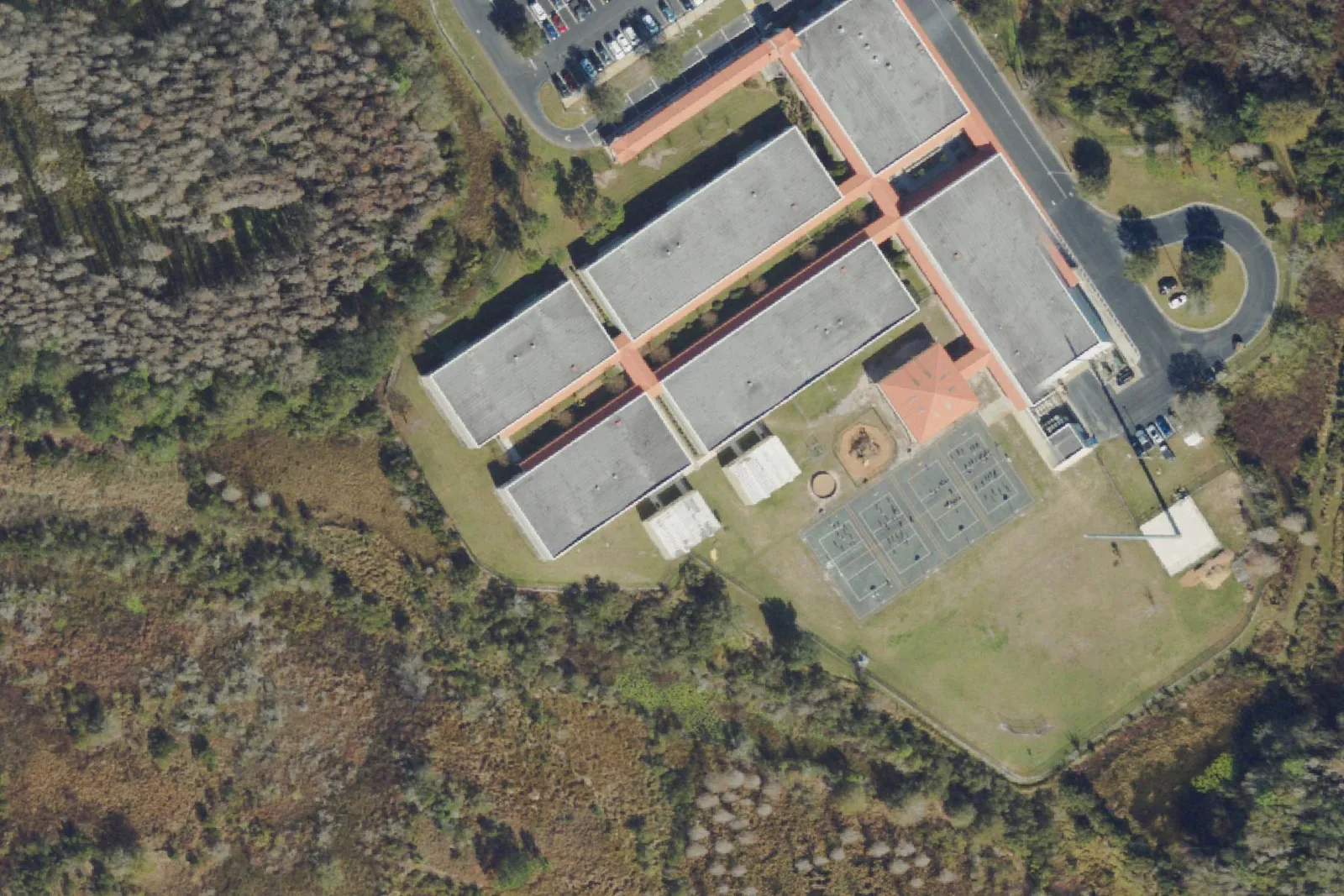 Watergrass Elementary School's classroom buildings, playground and courts off Overpass Road, seen from the air.