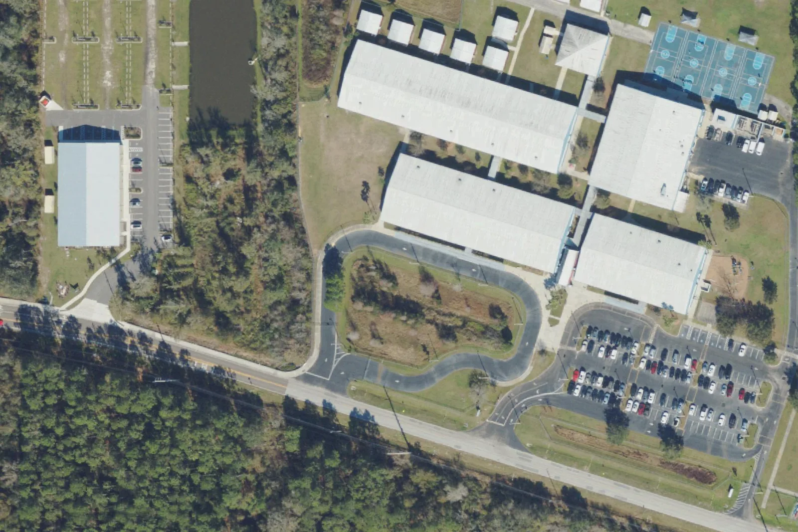 Wesley Chapel Elementary School's classroom buildings and courts on Wells Road, seen from the air.