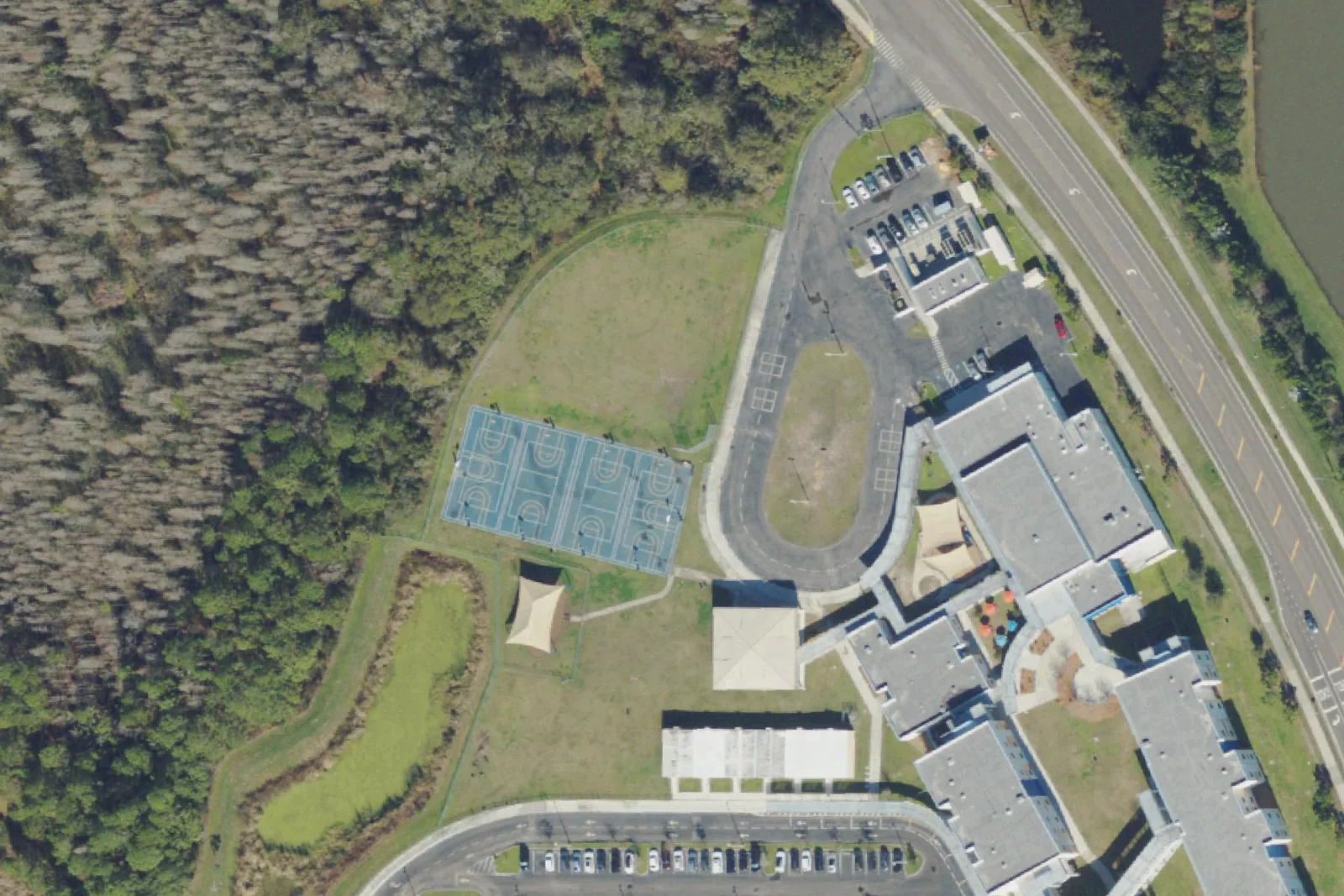 Wiregrass Elementary School's classroom buildings and grounds on Wiregrass School Road in Wesley Chapel, seen from the air.