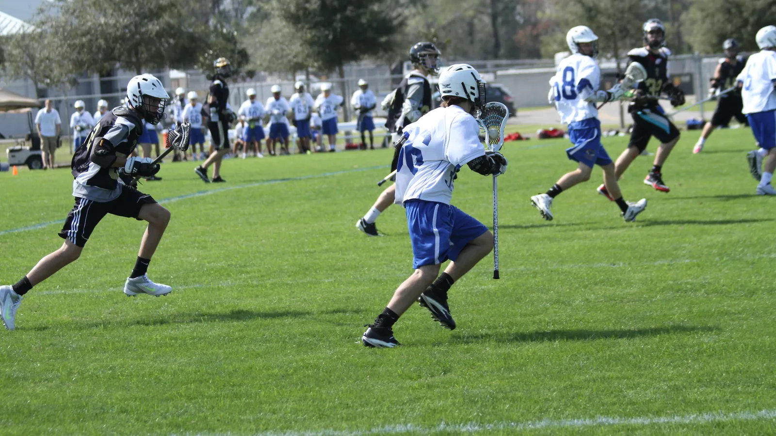 Youth lacrosse players on the fields at Wesley Chapel District Park on Boyette Road