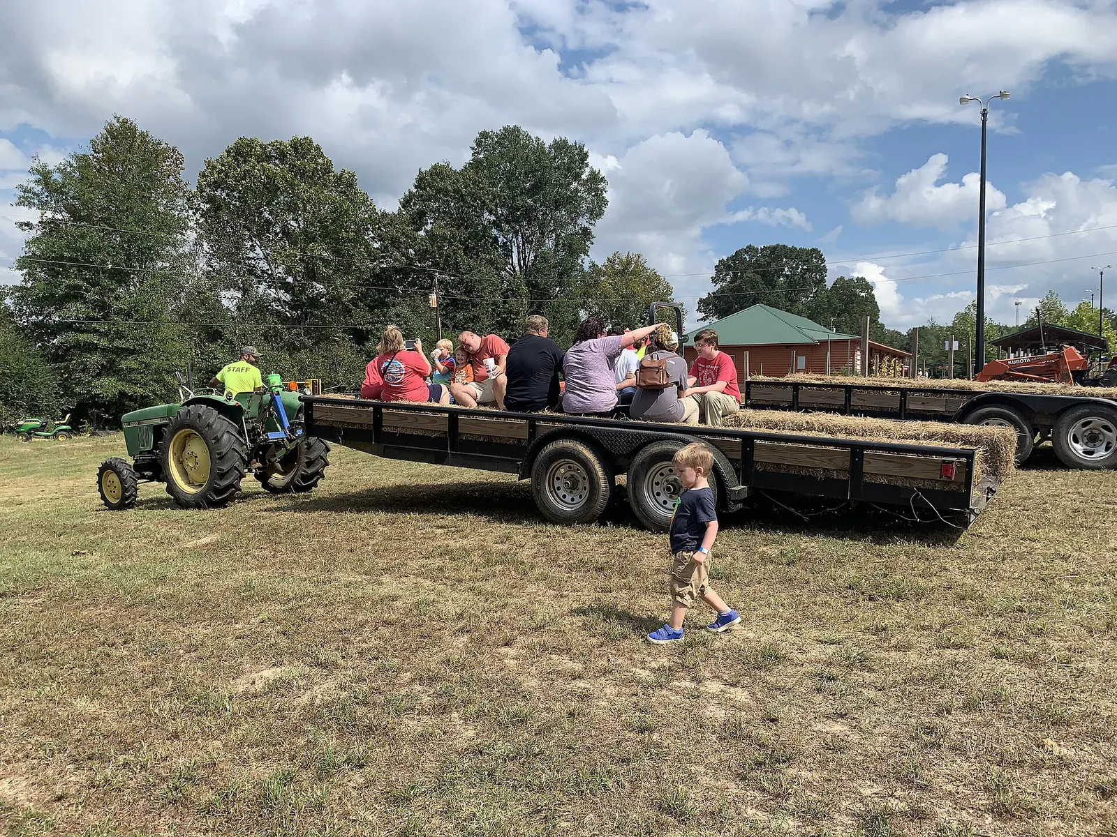 A tractor-pulled hayride at a fall pumpkin patch in Arkansas